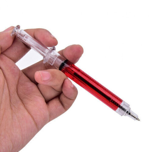Fecskendő formájú toll piros folyadékkal